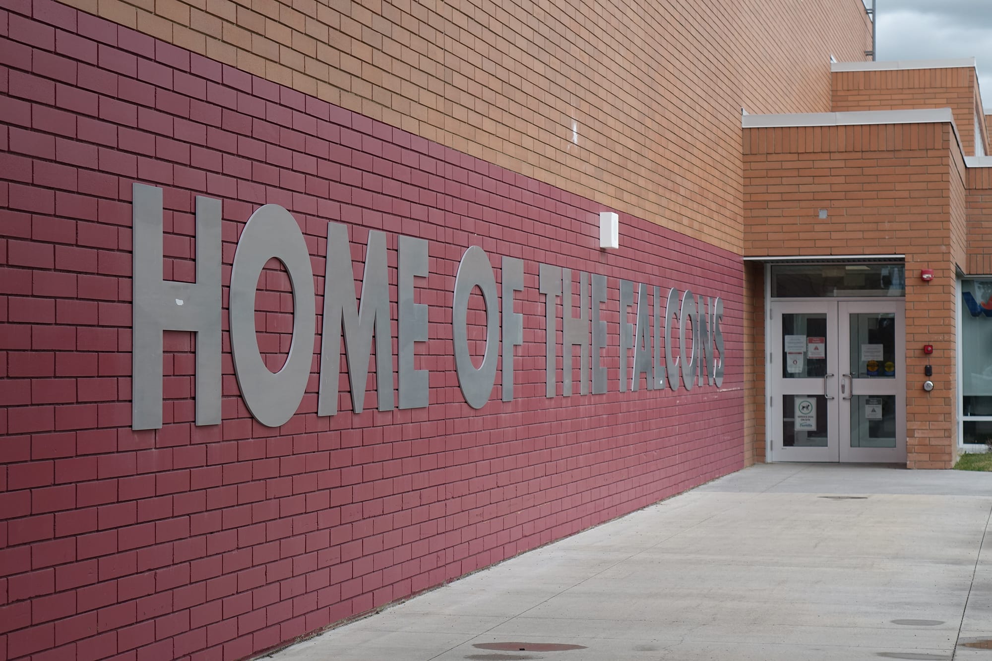 Foothills Composite High School wall with home of the Falcons
