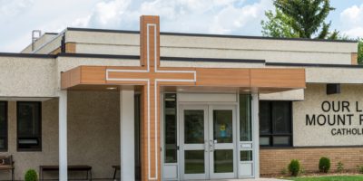 Our Lady of Mount Pleasant School exterior front entrance with cross