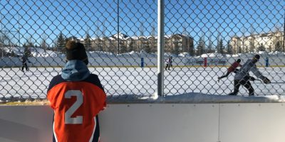 Tri Leisure Centre Outdoor Arena with a hockey player watching the play